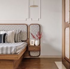 a bed sitting in a bedroom on top of a hard wood floor