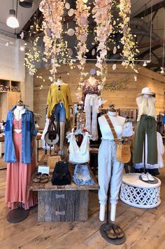 an assortment of clothing on display in a store