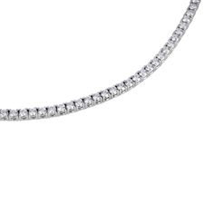 Available for order. (Orders Placed today will ship in approximately 2-3 weeks.) This tennis necklace is the epitome of elegance. A single row of scintillating round brilliant diamonds are set on four prong baskets and lined up perfectly to create a glamorous diamond necklace to complement your tennis bracelet perfectly. 14k White Gold Eternity/Line/Tennis Necklace 4-Prong Round Full Cut Diamonds = 5.50 Carats tw G-H Color VS2-SI1 Clarity 17" long Hidden diamond barrel clasp with safety Availabl Diamond Tennis Necklace, Tennis Necklace, Store Hours, Brilliant Diamond, Tennis Bracelet, Round Brilliant, 3 Weeks, Diamond Necklace, Diamond Cuts