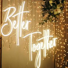 a lighted sign that says better together