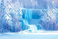 a snowy landscape with trees and a waterfall