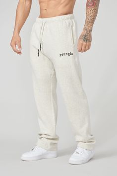 MATERIAL: 100% Cotton. Super soft fleece. FIT: Loose Fit. DESIGN: The first ever No Cuff joggers. Made with soft cotton fleece fabric with loose fitting. The joggers have open cuffs that lay over the shoes. Some of the features include an elastic waistband with adjustable drawcords, 2 side pockets, and high-density blackletter logo. MODEL: The model in the first photo is wearing a size Medium. Weight: 175lb Height: 5'9. Blackletter Logo, Jogging Pants Men, Men Sport Pants, Style Sweatpants, Cuffed Joggers, Jogging Pants, Lifestyle Clothing, Short Shirts, Cotton Fleece