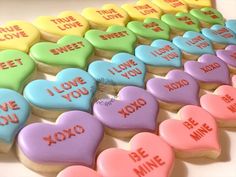 heart shaped cookies that say i love you and be mine with words written on them