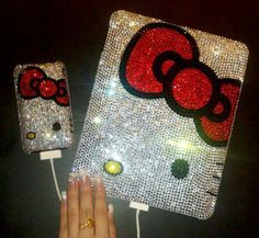 someone is holding up a hello kitty phone case that has been made out of sequins