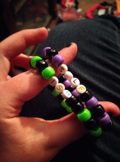 a person is holding some beads in their hand