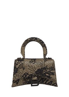 Find BALENCIAGA Hourglass Xs Lace Top-handle Bag on Editorialist. Balenciaga %22Hourglass%22 top handle bag in lace leather Rolled top handle Detachable, adjustable shoulder strap Can be worn as a top handle or shoulder bag Flap top with magnetic closure Approx. 5.1%22H x 7.4%22W x 3.1%22D Made in Italy Designer Black Bags For Events, Luxury Evening Bag With Handle Drop, Designer Top Handle Shoulder Bag For Events, Designer Evening Bags With Adjustable Handle, Luxury Evening Bag With Handle Drop For Events, Luxury Evening Bag With Handles For Events, Designer Shoulder Bag With Detachable Handle For Events, High-end Top Handle Evening Bag, Luxury Evening Bag For Party