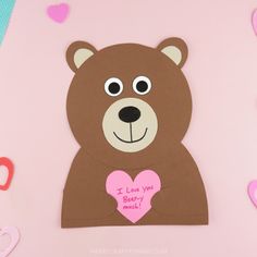 a brown bear holding a pink heart with the words i love you barry on it