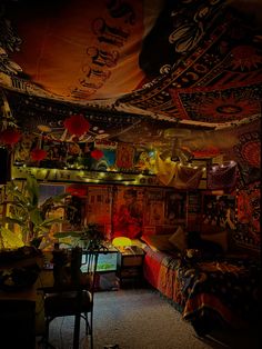 a room with many decorations and lights on the ceiling, including bedspreads