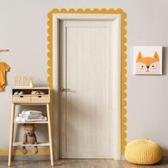 a baby's room with an open door and yellow accents on the wall, along with a teddy bear