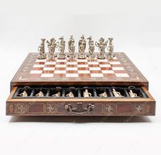 an antique chess set is displayed on a white background