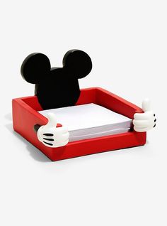 a mickey mouse shaped pen holder on a white background