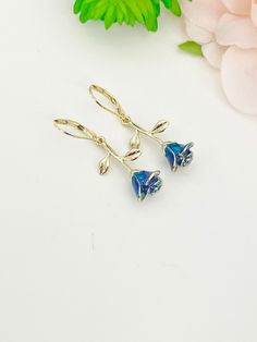 "Rose Earrings, HOW TO ORDER 1) Select the quantity 2) Select style (dangle/drop or lever back/hoop) 3) Add to cart DESCRIPTION ♥ 18K Gold over stainless steel/brass ear hook 19-22 mm. or 14.5 x 12 mm hoop ♥ Alloy Pendants, with Enamel, Rose Flower, Golden, Steel Blue Size: about 27mm wide, 14mm long, 9mm thick,  ** Conversion: 1 inch = 25.4 mm or 1 mm = 0.0393 inches, photo with penny to refer size only** Please Note: The color may be slightly different from the picture because of different display device. MAKE IT PERSONALIZED/ADDITIONAL ♥ Raw materials the USA and international sourcing. ♥ I do not include invoices in any packages unless requested. ♥ Handmade to order, please allow 3-5 days for us to make your item before shipping, ♥ Jewelry comes on Lebua Jewelry card, wrapped in a plas Rose Gold Dangle Hoop Earrings With Lever Back, Rose Gold Dangle Hoop Earrings, Blue Dangle Earrings For Mother's Day, Jewelry Card, Ear Hook, Rose Earrings, Blue Rose, Steel Blue, Rose Flower