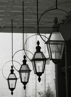 several hanging lanterns are shown in black and white