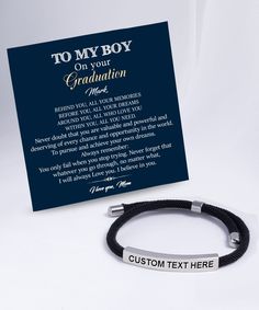 a bracelet with an inscription on it next to a card that says, to my boy