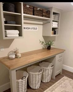 a wash and fold laundry room with baskets on the counter