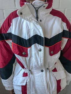 Vintage Rodeo Ski Wear | Multi color Ski Jacket | Rodeo Snowboarding Suit | Vintage Ski Suit | Winter Skiing Jacket | Unisex Ski Jacket Vintage great condition Rodeo ski wear, skiing jacket, fits for both genders. Rare, colorful, never seen anywhere, it looks crazy festive and so hot, that this winter season you must to have it. Very comfortable, stylish. Tag: Rodeo GREAT used condition : 10/10 Please enlarge the photos to get clear image. Measurement taken while laying flat. Shoulders: 50cm //1 White Windproof Outerwear For Snowboarding, Sporty Outerwear For Ski Season, Sporty Nylon Outerwear For Snowboarding, White Long Sleeve Outerwear For Snowboarding, White Nylon Skiing Outerwear, Ski Season Sports Outerwear With Pockets, Snowboarding Outerwear With Pockets For Ski Season, White Nylon Outerwear For Skiing, Casual Nylon Outerwear For Snowboarding