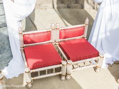 a couple of red chairs sitting next to each other