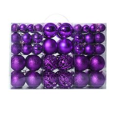 purple christmas ornaments in a clear box