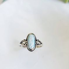 ~Opal Sterling Silver Ring~ Top Of Ring Height: 13.6mm X 7.5mm Band Width: 2.6mm Center Stone Size: 11.5mm X 6mm Stone Shape: Oval Lab Opal Total Number Of Stones: 1 Metal: 925 Sterling Silver Finish: High Polish 925 Stamped K E E P I N T O U Ch Https://Instagram.Com/Emmaverajewelry Https://Www.Facebook.Com/Emmaveradesign Thank You For Visiting My Shop Minimalist Sterling Silver Opal Ring Oval, Minimalist Sterling Silver Oval Opal Ring, Minimalist Oval Opal Ring In Sterling Silver, Adjustable Oval Opal Ring In White Gold, Sterling Silver Opal Ring, Silver Opal Ring, Ring Minimalist, Minimalist Ring, Ring Oval