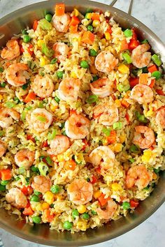 shrimp and rice with peas in a pan