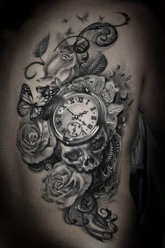 a black and white photo of a clock with roses on the side of a man's back