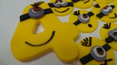 some yellow and black decorated cookies with eyes