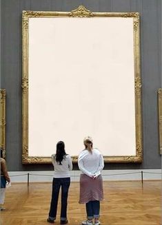 two women standing in front of a large painting looking at it's own reflection