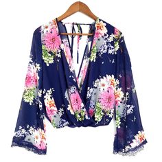 Forever 21 Floral V-Neck Wrap Front Flare Sleeve Crop Blouse Size Medium 100% Polyester. Floral Print. Surplice V-Neck. Flare Sleeve. Tie Back. Cropped. Navy Blue And Pink. Sheer Fabric. Lace Trim. Measurements Laid Flat: Length 20" Sleeve 24" Condition: Nwt - New With Tags Tags: Blouse, Cropped, Top, Closet Staple, Casual, Comfy, Spring, Summer Forever 21 V-neck Blouse For Brunch, Forever 21 V-neck Blouse For Night Out, V-neck Blouse For Brunch From Forever 21, Navy Blue And Pink, Pink Sheer, Neck Wrap, Sheer Fabric, Crop Blouse, Blue And Pink