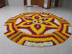 a circular flower arrangement on the floor in a room