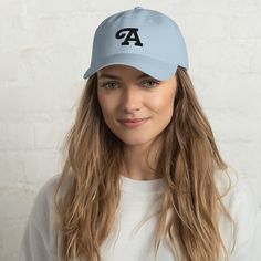 "Available in blue or pink with a black letter in a bold, stylized font. Makes a cute, simple, and preppy gift for youth, especially during back-to-school season. Enter your custom letter above before adding to cart. Hat is adult-sized, so is most appropriate for children 10 years of age and older. * 100% chino cotton twill * Unstructured, 6-panel, low-profile * 3 ⅛\" crown * Adjustable strap with antique buckle * Head circumference: 20 ½\" - 21 ⅝\"" Yin En Yang, Embroidered Artwork, Mom Hats, Hunter Jumper, Classic Hats, The Pug, Embroidered Caps, Camo Colors, Embroidered Hats