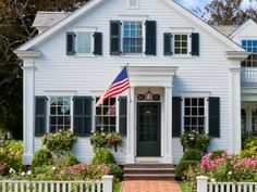 a white house with an american flag on the front