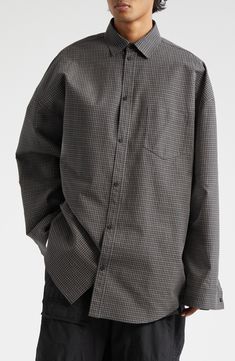 An oversized shirt is nothing new in the Balenciaga pantheon, but the twist here is that it's more of a jacket masquerading as a shirt (and no actual twist). What appear to be a proper button placket and button cuffs are camouflage for snap closures, bringing stealth jacket function to the voluminous cotton-poplin style. 29" length (size medium) Front snap closure Spread collar Long sleeves with snap cuffs Dropped shoulders Chest patch pocket Curved hem 100% cotton Dry clean Made in Italy Design Oversize Shirt, Nothing New, Italy Design, Oversized Shirt, Button Placket, Cotton Poplin, Shirt Jacket, Snap Closure, Patch Pocket