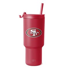 a red tumbler with the san francisco giants logo on it and a straw in its mouth