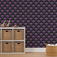 the wallpaper in this room has purple flowers on it and is next to a wicker basket