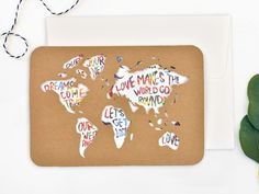 a greeting card with the words love makes the world go round