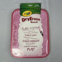 a pink plastic tray with writing on it