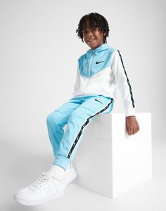 Get them an upgrade in this children's Tape Poly Full Zip Tracksuit from Nike. In a Blue and White colourway, this tracksuit is made from a smooth and lightweight poly fabric to keep your kiddo comfy. It features a full zip hoodie for custom coverage, ribbed trims to hold the shape, and split pouch pocket for storage. The matching track pants have an elastic waistband and cuffed ankles to hold the shape. Signed off with Nike branding throughout. Nike React Vision, 270 Nike, Nike Branding, Leggings Hoodie, Childrens Clothing, Nike Brand, Blue Nike, Jd Sports, Full Zip Hoodie