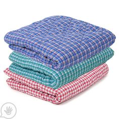 three blankets stacked on top of each other