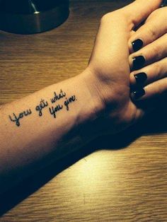 a woman's arm with a tattoo that says, you got what you give