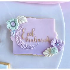 a decorated cookie on a plate with the words eat, celebrate