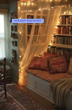 a room with a bed, bookshelf and lights on the wall above it