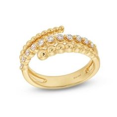 a yellow gold ring with white diamonds