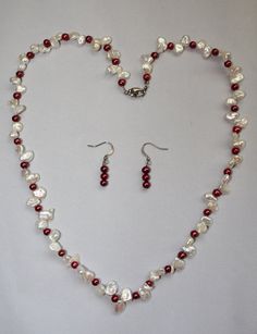 "I love the colors in this necklace.  It's a very crisp white necklace with burgundy peeking out here and there.  The necklace is 21 1/2\" long, and the matching earrings are 1 1/4\".  Keep in mind that the earrings have just the burgundy colored pearls.  The burgundy pearls are small, round pearls, and the white pearls are irregular shaped pearls.  You could call them popcorn pearls.  They give this dimension and interest.  One thing that you'll love about this is how lightweight it is.  And th Colored Pearls, Maid Outfit, White Necklace, White Jewelry, Pearl Color, Burgundy Color, Matching Earrings, Pearl Jewelry, Pearl White