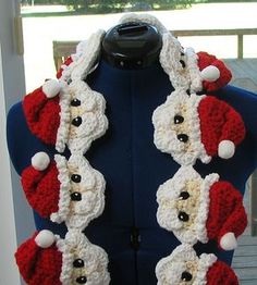 a mannequin wearing a santa hat and scarf with buttons on it's chest