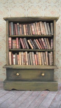 an old book shelf with many books on it