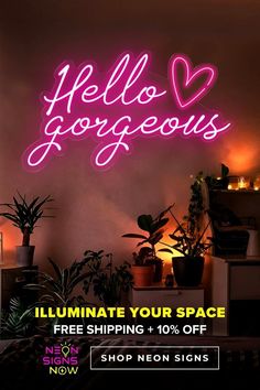 a neon sign with the words hello gorgeous illuminated in pink and purple on a wall