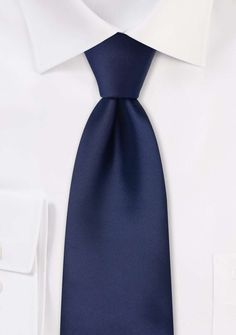 Elevate your style with the understated sophistication of our Navy Solid Necktie. Timeless and versatile, this necktie is a must-have when shopping for mens suits or seeking the perfect accessory to complete your tuxedo ensemble. The rich navy hue exudes confidence and class, making it the ideal choice for formal occasions such as weddings or black-tie events. Its solid design allows for endless pairing options, effortlessly complementing a range of suit colors and patterns. Whether you're aimin Elegant Solid Bow Tie, Modern Standard Tie For Office, Elegant Ties For Black Tie Events, Elegant Standard Ties For Business, Dapper Solid Color Ties, Elegant Standard Tie For Semi-formal Occasion, Modern Standard Tie For Semi-formal Events, Modern Standard Tie For Semi-formal Occasions, Elegant Neckwear With Inside Ties For Semi-formal Occasions