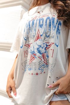 Our Cowboys Graphic Tee features a crew neckline and a cowboy design graphic. Oversized Fit 100% Cotton Distressed Hand Wash Cold, Hang Dry Julia Havens, Cowboy Design, Strapless Tops, Fall Style, Swimsuit Tops, Denim Shop, Shoes Heels Boots, Oversized Fits, Crew Neckline