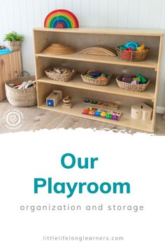 an organized playroom with baskets and toys on the bottom shelf, text overlay reads our playroom organization and storage