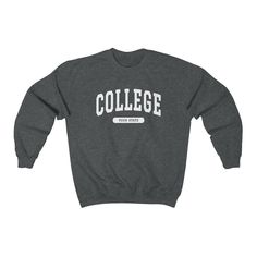 Your Text College Crewneck Sweatshirt Treat yourself with this cozy personalized college style sweatshirt! PLEASE FOLLOW THE CUSTOMIZATION INSTRUCTIONS IN THE PERSONALIZATION BOX ABOVE! If you prefer it is of course also possible to only have the big text printed on your sweatshirt without the text in the small box! --- - This soft sweatshirt has a loose fit for a comfortable feel - Durable print - Loose fit - 50% Cotton; 50% Polyester (fibre content may vary for different colors) - Runs true to College Crewneck Sweatshirts, College Crewneck, Attractive Clothing, University Style, College Sweatshirt, College Design, Custom Sweatshirts, Heritage Collection, College Fashion